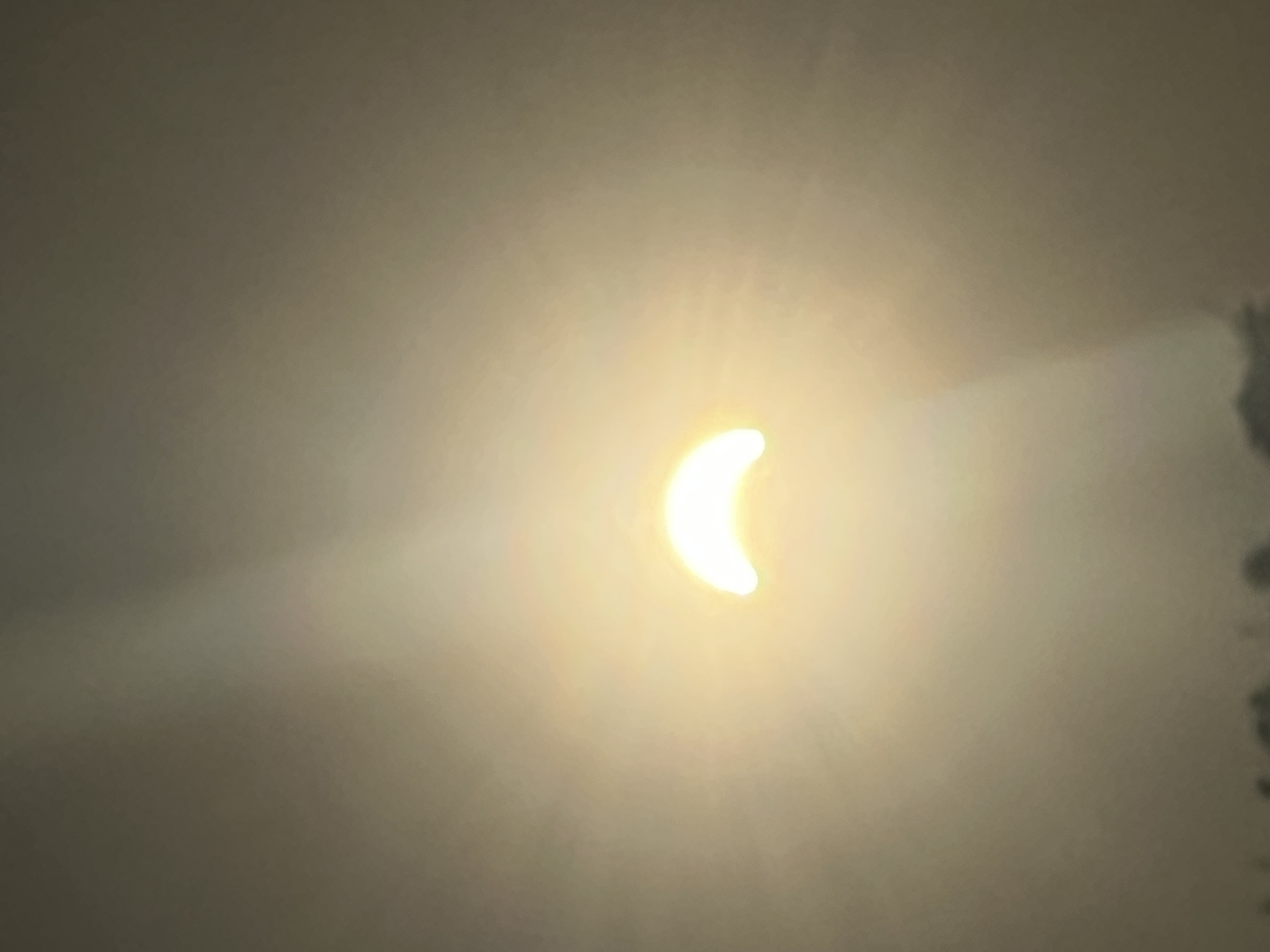 the sun at 19:10:03, the exact predicted second of maximum eclipse, nowhere near 90% covered