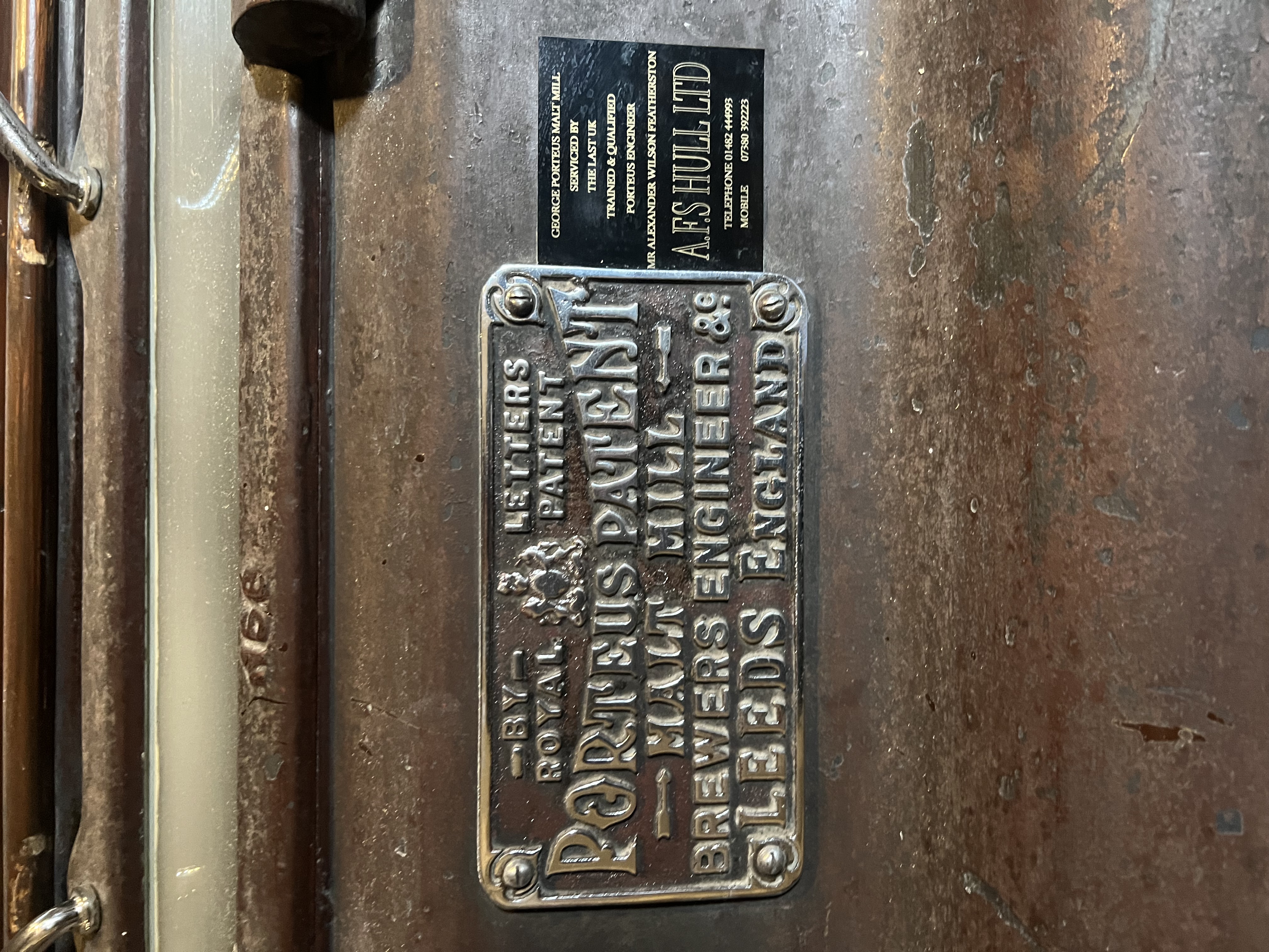 the Porteous makers plate, and a much smaller modern one next to it